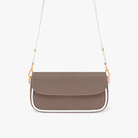 Small brown leather shoulder bag with curved flap and white strap with gold links