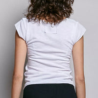 Off-white textured knit top, back view, short sleeves and curved yoke seam