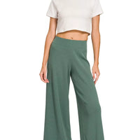 Jade green wide-leg pants with matching cropped knit top