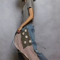 Grey pinstripe V-neck short sleeve top with stitch seam detail, side view