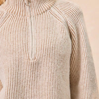 Taupe ribbed knit top with stand collar and quarter-zip placket, close-up