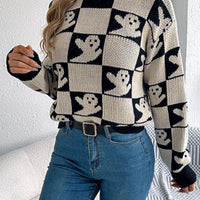 Ghost checkerboard knit sweater in black and cream with ribbed crew neck and cuffs