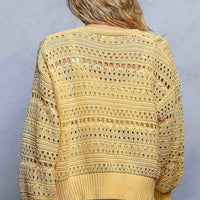 Yellow open-knit button cardigan with allover pointelle texture and ribbed cuffs