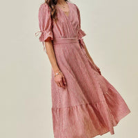 Red striped wrap midi dress with ruffle sleeve cuffs and tie belt waist