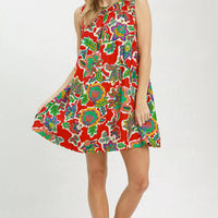 Red sleeveless shift dress with colorful abstract floral print and flared skirt
