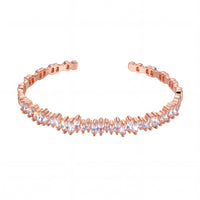 Rose gold ice cuff bangle with baguette-cut clear stones, flexible curved shape