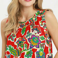 Close-up of red sleeveless shift dress with colorful abstract floral print