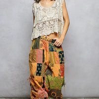 Patchwork wide-leg printed pants with gathered elastic waist and side drawstring ties