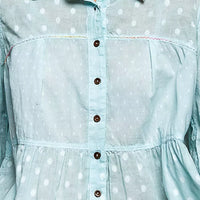 Aqua polka-dot woven shirt close-up: button placket and gathered waist panel