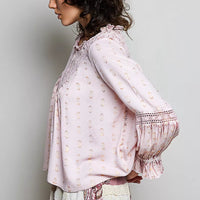 Rose pink lace-trim blouse with flared ruffle cuffs and elastic sleeve opening, side view