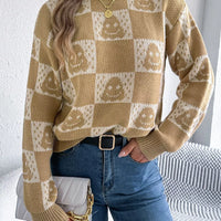 Beige checkerboard knit sweater with jack-o-lantern face print, crew neck, long sleeves