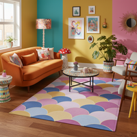 Large rectangular rug with scallop arcs in pink, blue, yellow, and cream.