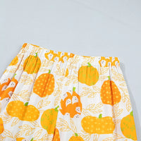 Printed lounge shorts with orange pumpkin and leaf pattern, elastic waistband