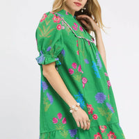 Green floral V-neck dress with short puff sleeves and relaxed fit