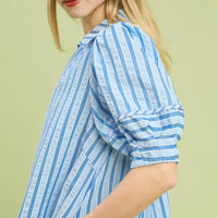 Striped midi dress sleeve with ruffled puff cuff in blue-and-white.