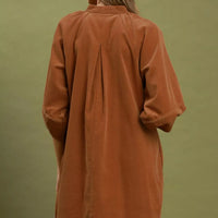Camel brown corduroy shift dress back view with puff sleeves