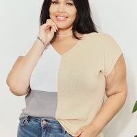 Color-block knit V-neck top with short sleeves; beige and white front panel with gray side