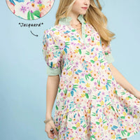 Green floral babydoll dress with ruffle collar, puff sleeves, tiered skirt