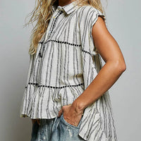 Grey multi-striped sleeveless cotton top with ruffle tiers and V-notched neckline