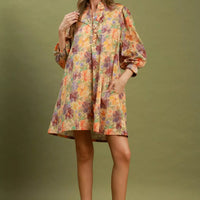 Floral print mini dress with button front, puff sleeves, and smocked cuffs