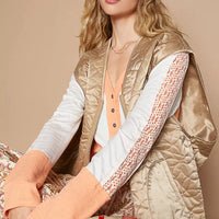 Mocha quilted vest with front zipper, V-neck, and side pockets