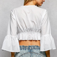 Ivory cropped blouse back with elastic waist and ruffled bell sleeves