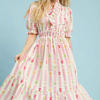 Cream midi dress with vibrant zigzag print, smocked bodice, puff sleeves, ruffled hem