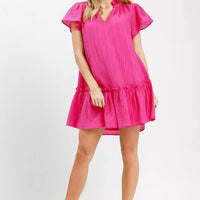Fuchsia textured mini dress with V-neck, flutter sleeves, and tiered ruffle skirt