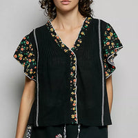 Black V-neck ruffle-sleeve blouse with floral trim and vertical piping