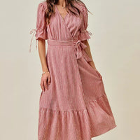 Red and white striped wrap midi dress with ruffle sleeve cuffs and tiered hem