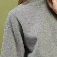 Grey mock-neck knit sweater top, ribbed collar detail