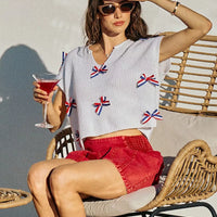 Off-white dolman sweater top with V-neck and red-white-blue ribbon bow appliques