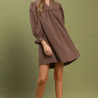 Chocolate textured mini dress with puff sleeves, V-neck cut, and gathered skirt