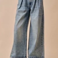 Light-wash mid-rise wide-leg denim jeans with pleated waist and cuffed hem