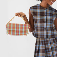 Plaid shoulder bag with white strap and gold chain, front flap