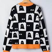 Back view of black and white ghost checkerboard sweater with orange ribbed trim