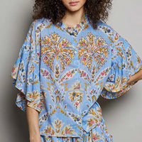 Blue floral printed woven ruffle-sleeve shirt with loose fit and elastic waist, front