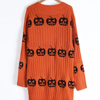 Orange open-front knit cardigan with black jack-o'-lantern motif knit, back view