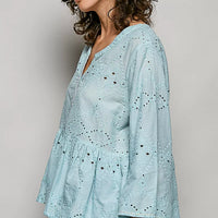 Aqua cotton eyelet peplum button-front shirt, V-neck, side view with full sleeves