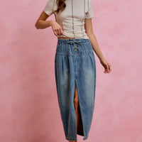 Washed denim midi skirt with front slit and button waistband, side view