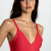 Red bandage dress with V-neck and slim straps, structured bust seams