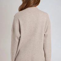 Mocha high-neck jumper, back view with long sleeves and shoulder button detailing