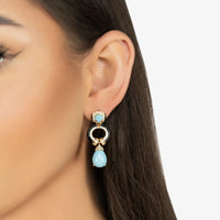 Turquoise and gold-tone drop earrings with circular black center and blue teardrop detail