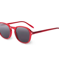 Red round sunglasses side view with dark tinted lenses and slim arms