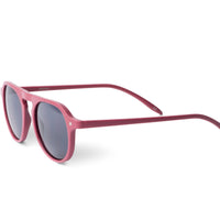 Raspberry pink rounded sunglasses with dark lenses, angled side view