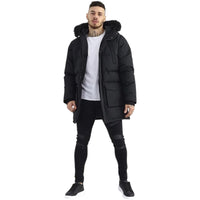 Black longline padded parka with a hood trimmed in faux fur and front pockets.