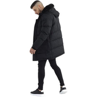 Side view of a black longline parka with horizontal padding and a faux fur hood trim.