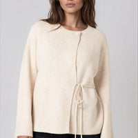 Beige knit cardigan with round neck and side tie, wide sleeves