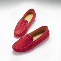 Pair of red suede penny loafers with tan insoles and stitched apron toes