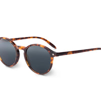 Tortoise sunglasses, side view, dark round lenses with thin green-tipped temple arms